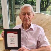 Stuart Green of Chippenham with his award for donating 150 pints of blood.